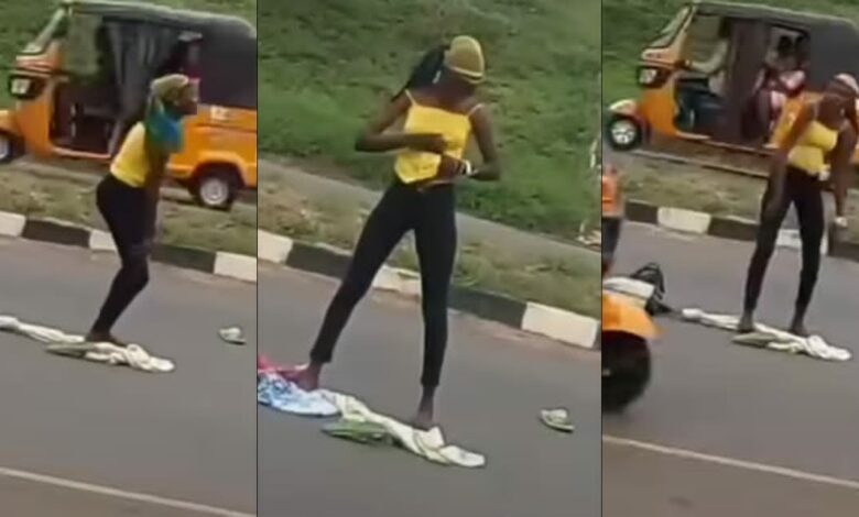 Lady runs mad after being dropped by an alleged yahoo boy in middle of a road