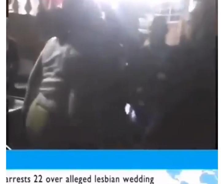 Police officers arrest lesbians