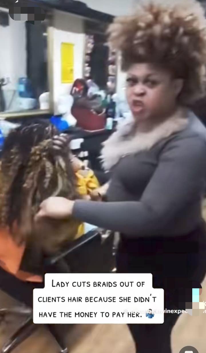 Hairstylist cuts customer's hair