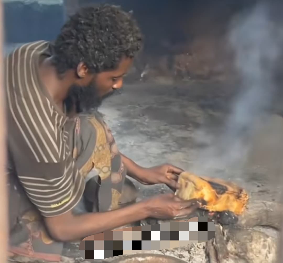"Things dey occur o" - Heartbreaking video of a homeless man cooking bread using firewood and stones causes stir