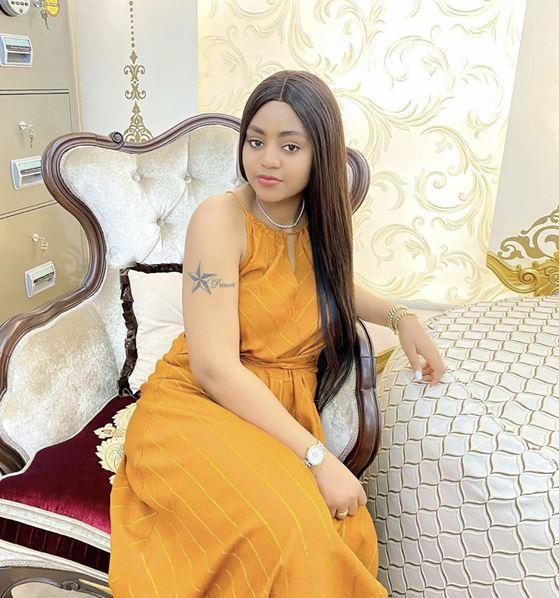  Lady inks tattoo of actress, Regina Daniels on her body 