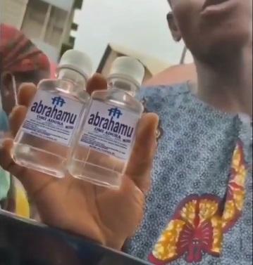 Pastor spotted selling N200 'get rich' holy water in Lagos traffic (Video)