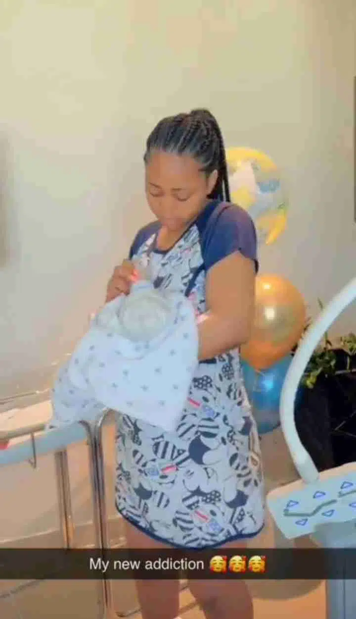 Heartwarming video of Regina Daniels cradling newborn son