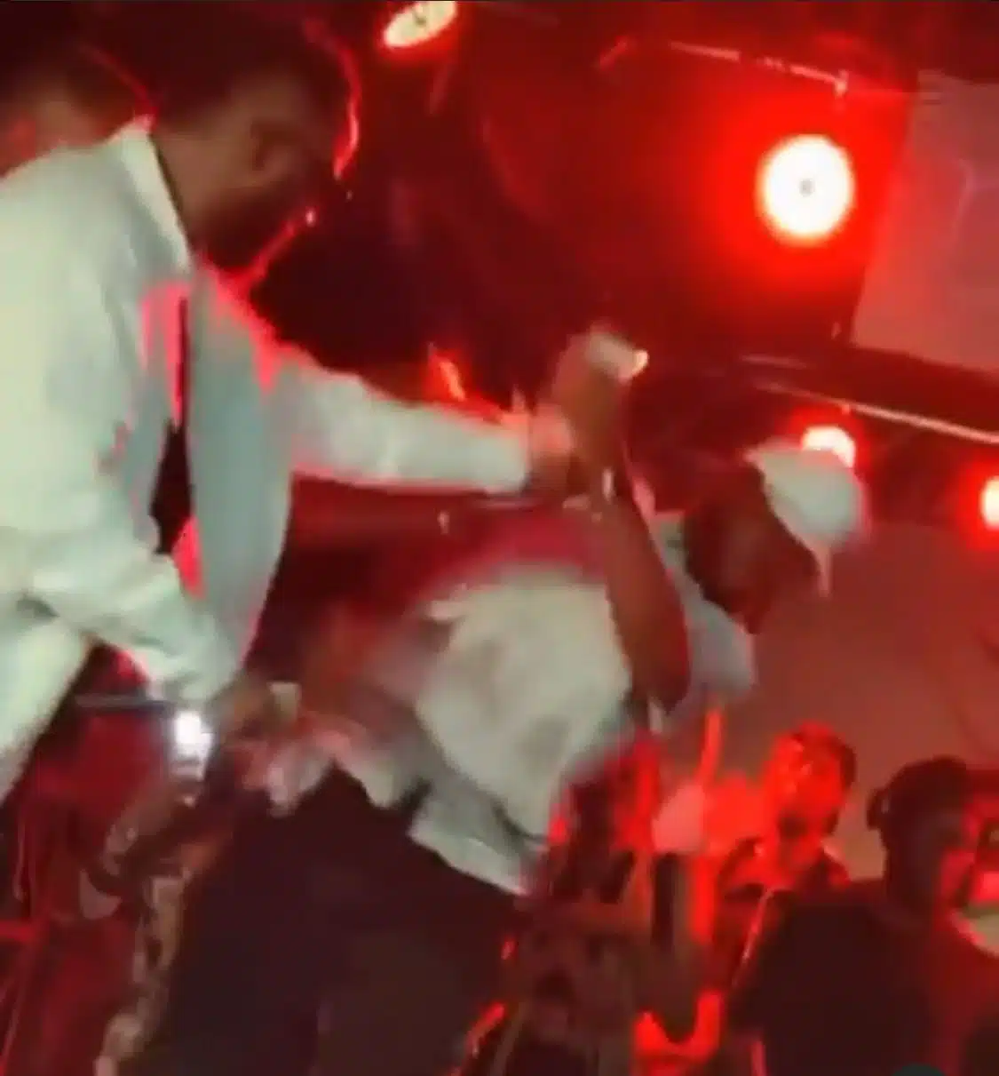 Moment Iyanya pushes fan off stage for slapping him with money (Video)