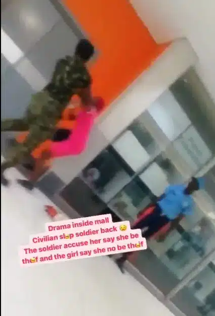 Lady lands back a slap on a soldier who first assaulted her 