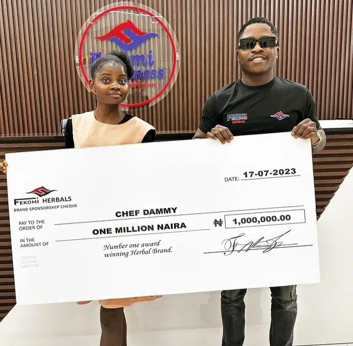 Chef Dammy all smiles as she receives N1m from businessman