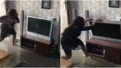 Nigerian lady destroys boyfriend’s TV for allegedly cheating on her with her best friend (Video)