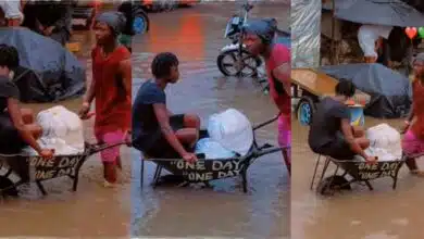 Man wheel barrow flooded