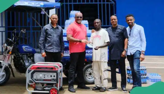 Aquafina empowers viral hawker, Dr. H2O, rewards him with full business setup worth millions of naira