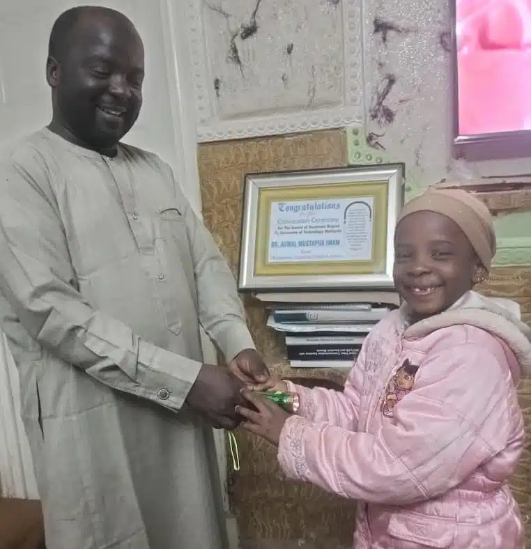 Father signs contract with daughter as he buys her a new torchlight