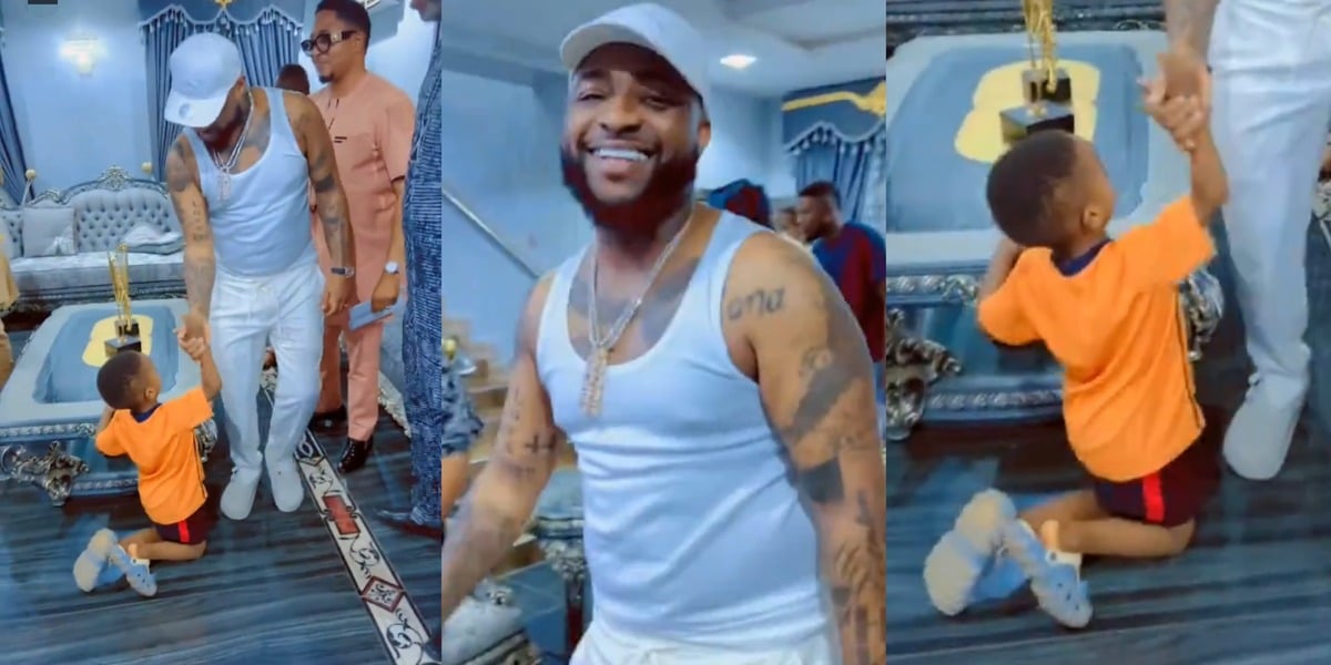 Little boy leaves crowd in awe as he goes on both knees to greet Davido