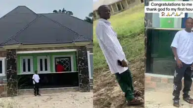 Young boy raises eyebrows as he celebrates building his house