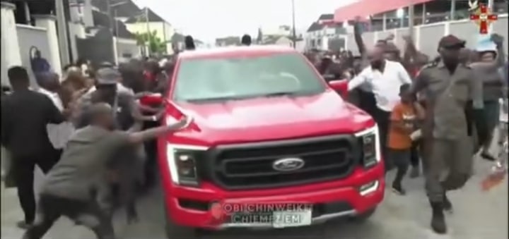 Church members rush tap God's blessings from pastor's car 