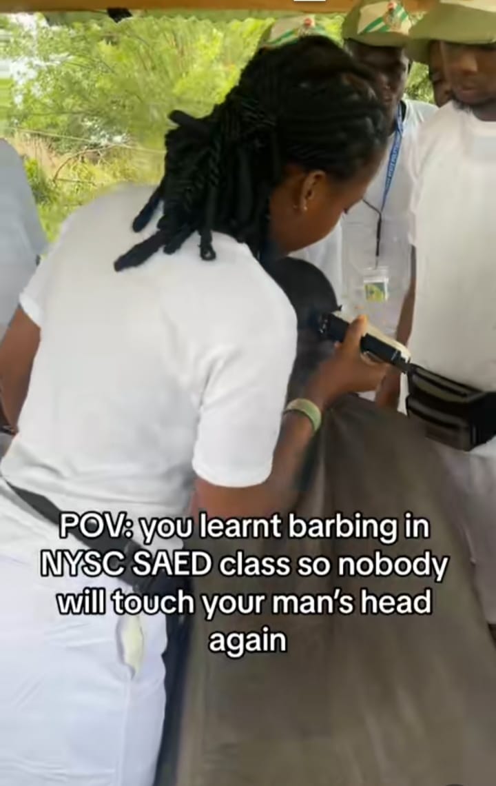 Female corper wows colleagues as she shows off impressive barbing skills during SAED class 