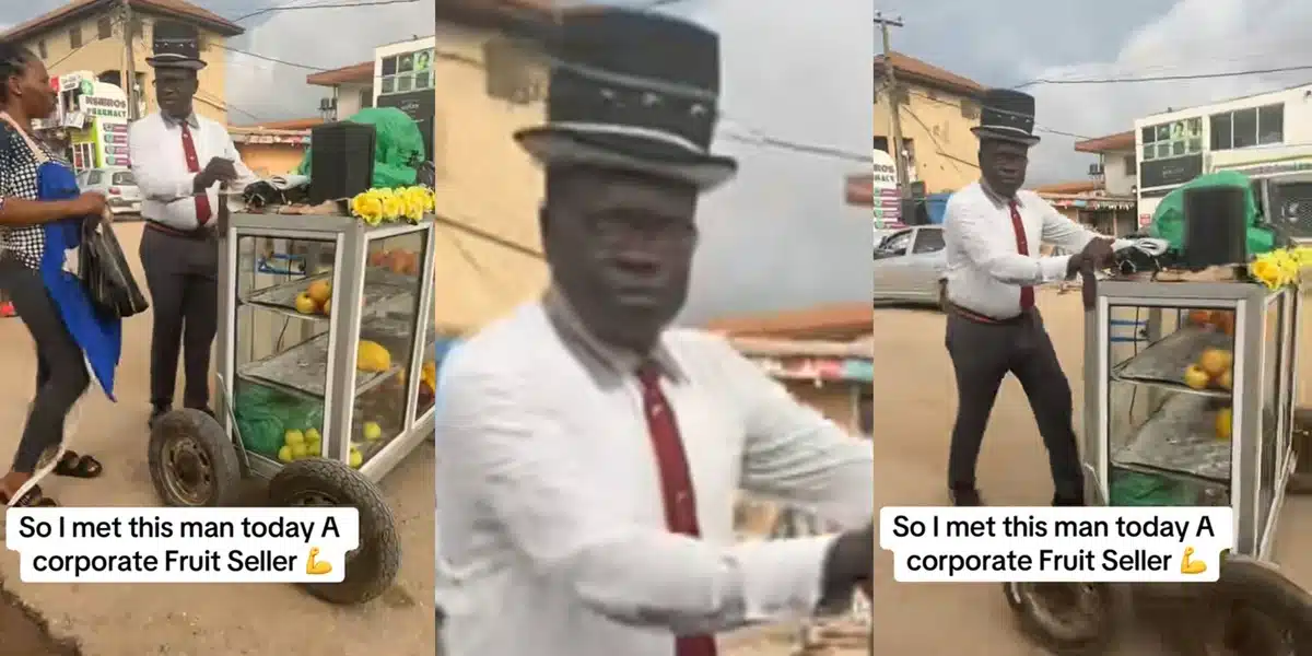Nigerian man raises eyebrows as he sells fruits in full corporate wear