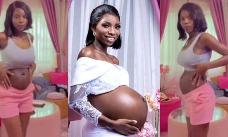 Lady shows off her stomach one month after giving birth to triplets via C-section