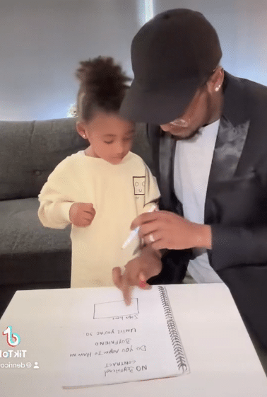 Video of man making his little daughter sign a contract to stay away from boys until 2051 causes buzz online