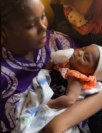 Lady in awe as friend's newborn baby yawns and covers her mouth herself, video stirs reactions
