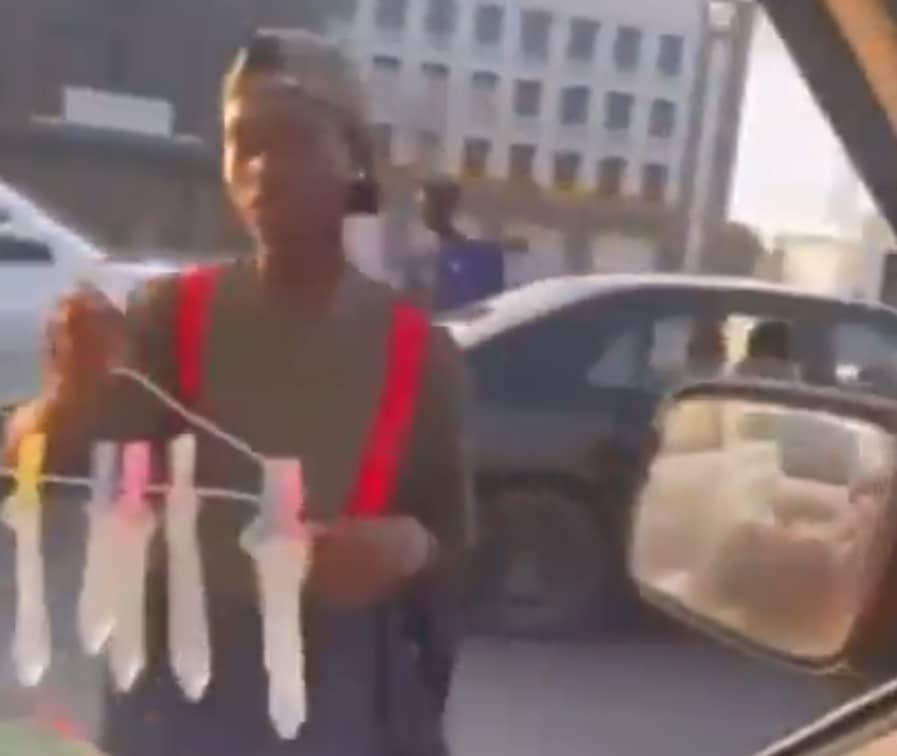 Nigerian man advertises 'wash and wear' condoms on Lagos streets for ₦200 each