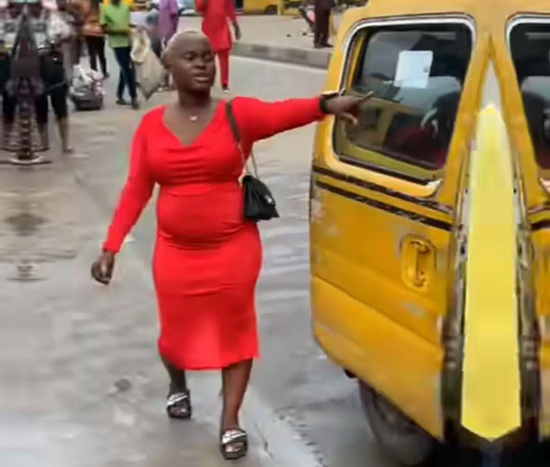 Nigerian lady works as both a bus conductor and driver to earn a living