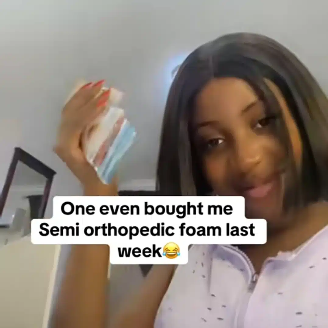 Nigerian lady flaunts foreign currencies, iPhone 15 Pro Max as oyibo lover spoils her, regrets dating stingy men