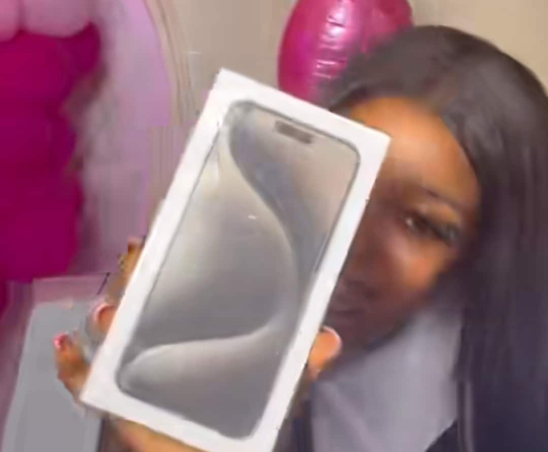 Nigerian lady celebrates 1st anniversary with brand new iPhone 15 Pro Max, ₦3 million cheque from Boyfriend