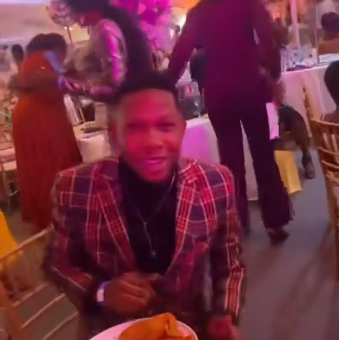 Viral video shows man on his knees begging food at Davido wedding, despite eating twice