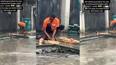 Heartbreaking moment as groundnut seller slips during heavy rain fall, goods scatter on ground