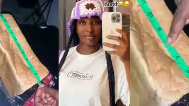 Nigerian lady goes viral as she uses sewing tape to equally measure bread to avoid fight with sister