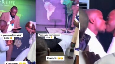 Nigerian groom shocks guests by doing push-ups before kissing bride at wedding
