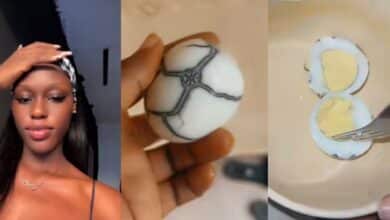 Nigerian lady surprises online community as she finds egg with unusual design