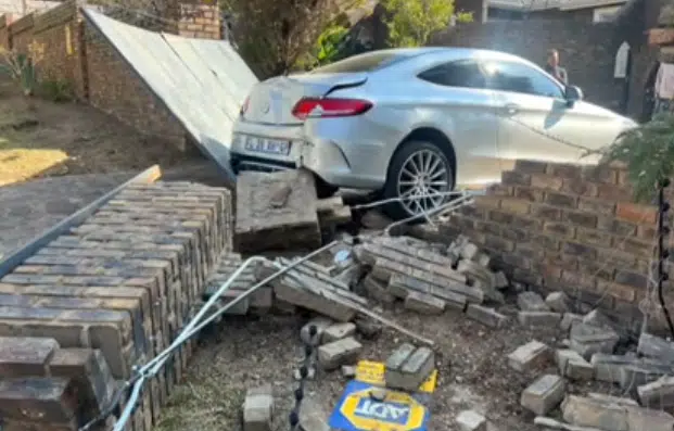 Moment son asked to reverse Mercedes-Benz, crashes it through garage door and wall