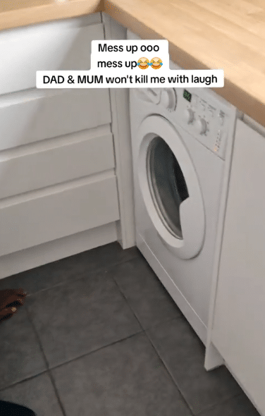 Nigerian couple visits son abroad for first time, sits down in disbelief to watch washing machine