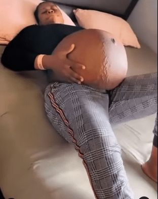 Netizens baffled as lady shows off unusually large baby bump, video stirs emotions