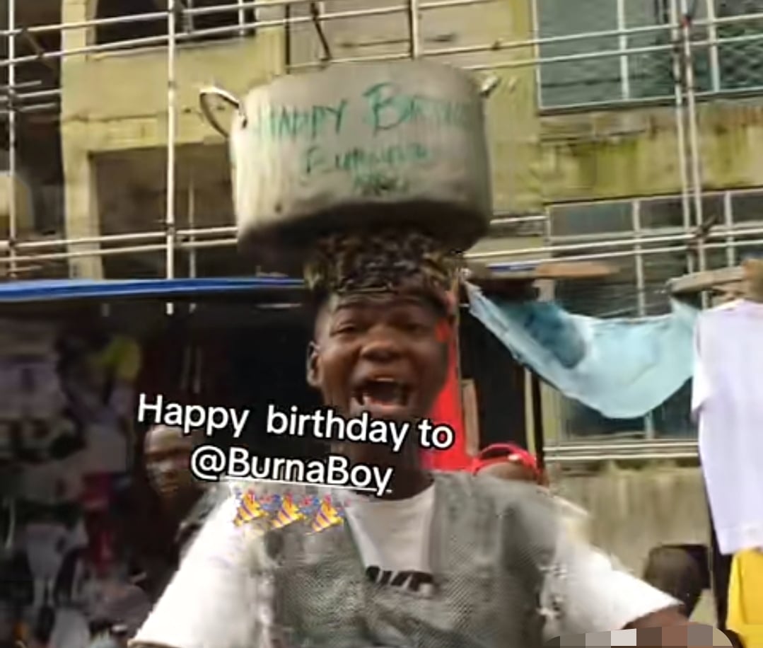 Nigerian man celebrates Burna Boy's birthday by hawking "Happy Birthday" pot in market