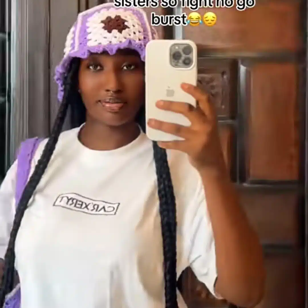 Nigerian lady goes viral as she uses sewing tape to equally measure bread to avoid fight with sister