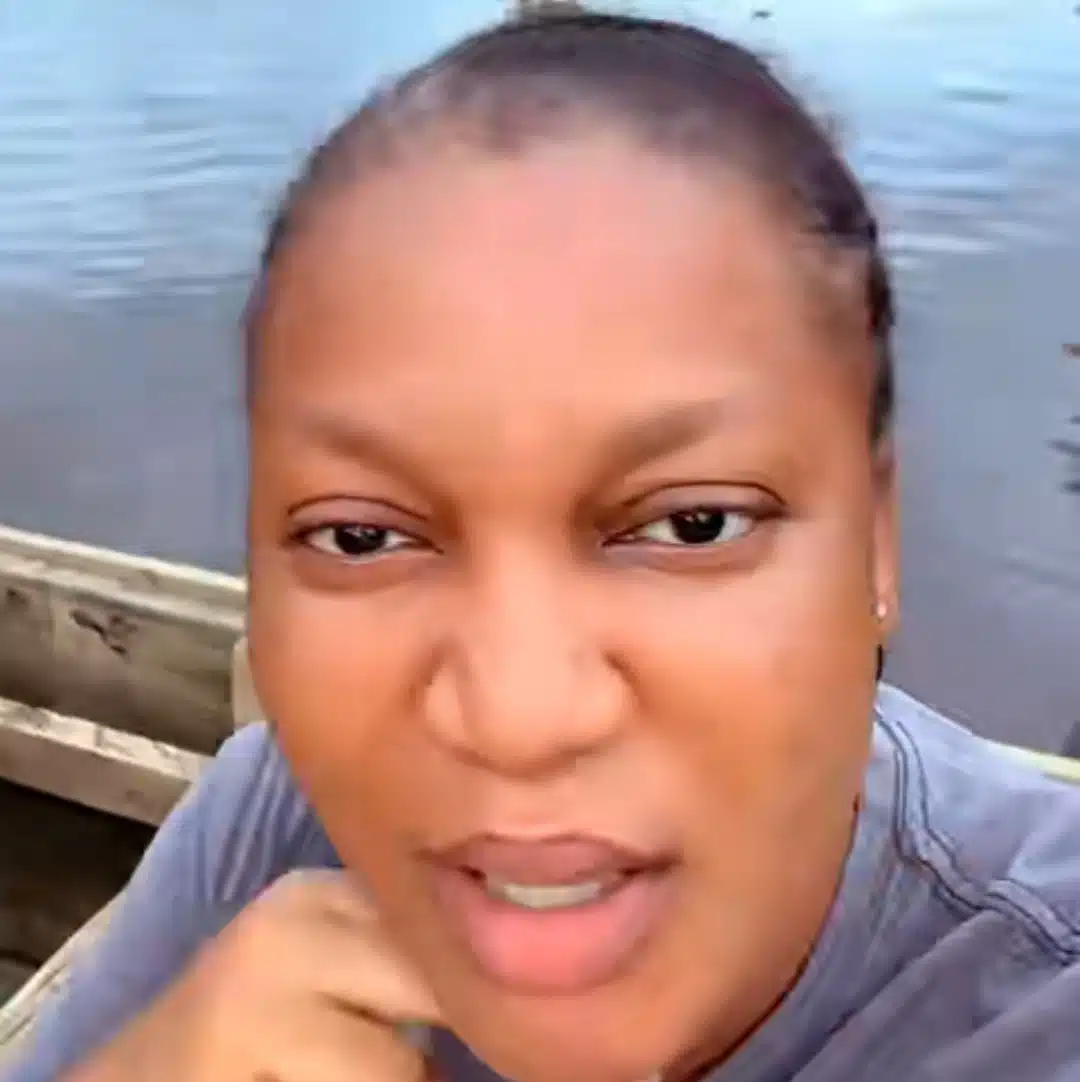 Nigerian lady uses canoe for transportation as her street floods due to heavy rainfall