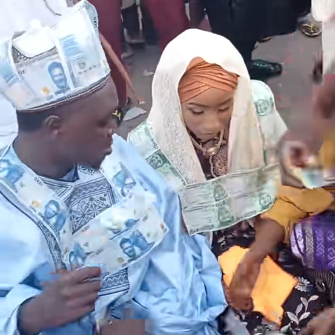Nigerian man, wife wear naira note necklaces at wedding