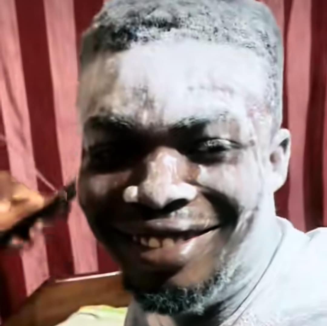 Nigerian man and friends bathe in white powder to celebrate childbirth