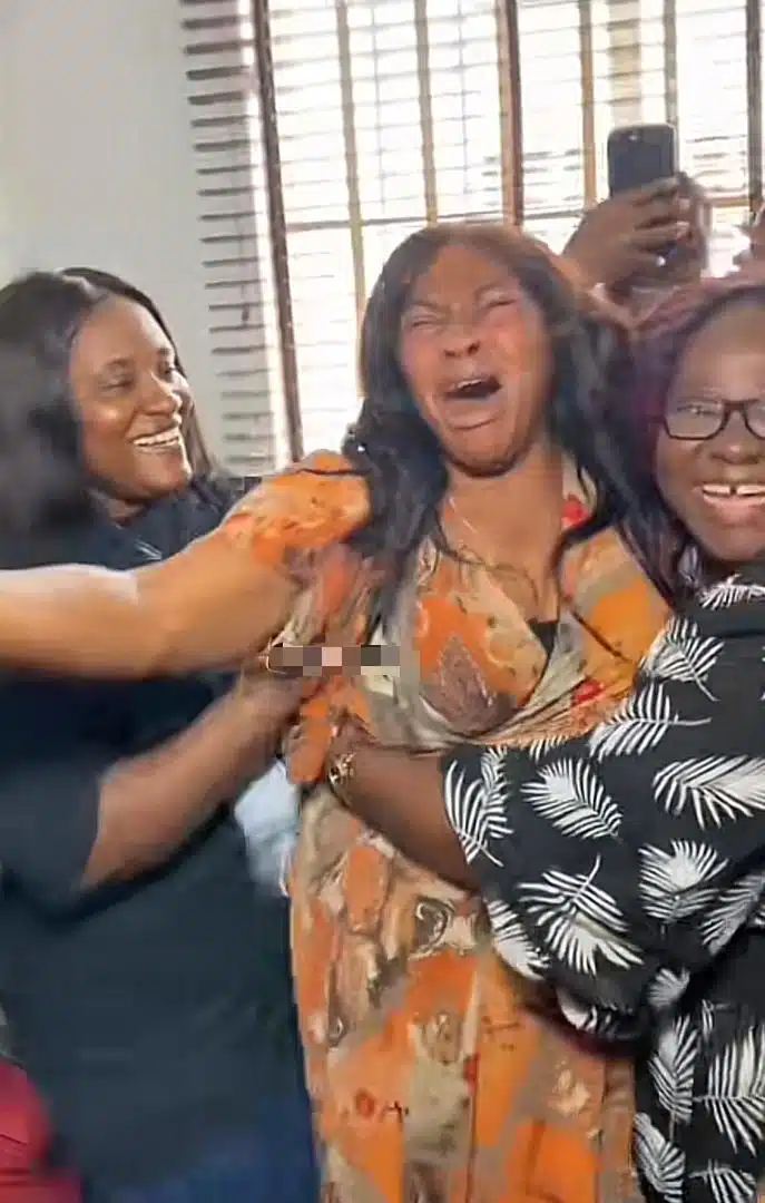 Emotional moment daughter surprises mother at work on 60th birthday