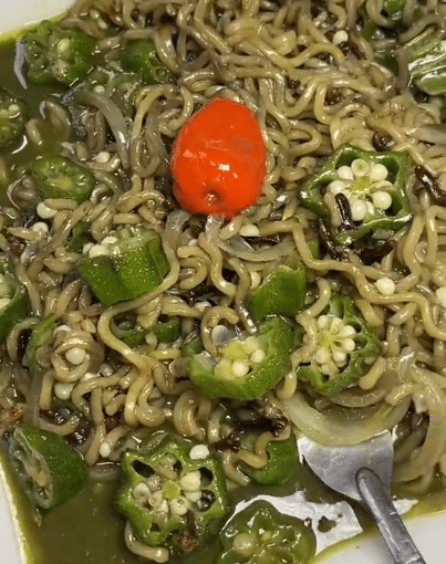 Lady causes serious buzz online as she prepares noodles with Okra