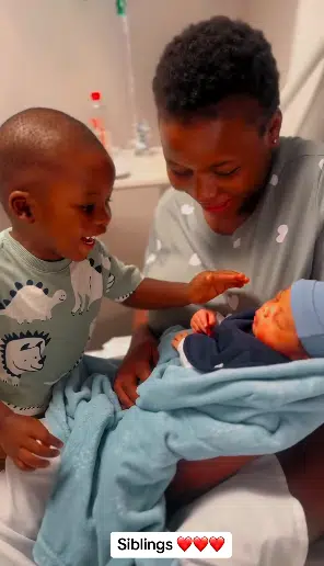 Adorable moment little boy meets his baby sibling for the first time