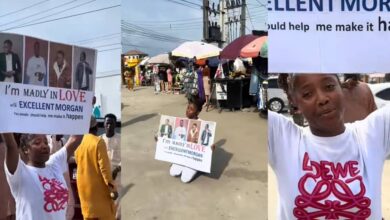 Nigerian lady raises eyebrows with a large poster professing her love for a man in Lagos