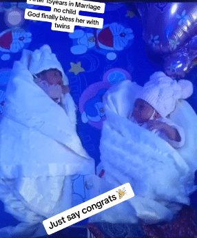 Neighbors gather to celebrate with woman who welcomed twins after 15 years of childlessness