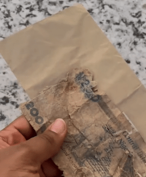 Newly wedded laments as she flaunts torn old N200 she saw in envelope as wedding gift