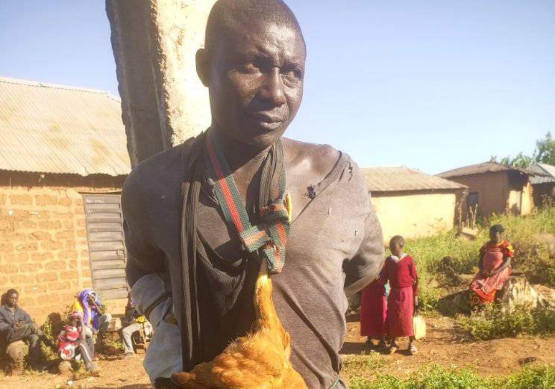 Man caught stealing chicken forced to wear it as a tie in public