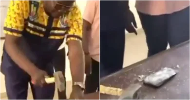 Moment lecturer breaks student's iPhone 13 with hammer