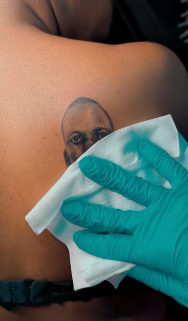 Lady goes over and beyond to tattoo boyfriend's face on her back