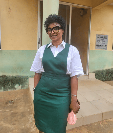 Woman dresses up in uniform as she attends her secondary school's 40th reunion