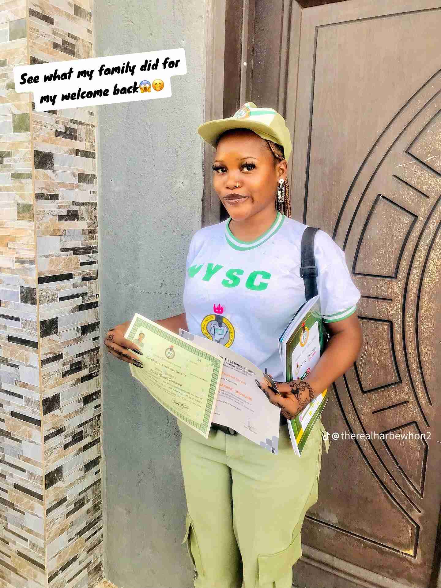 "First graduate" – Family sets up huge banner as their daughter completes NYSC